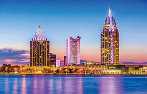 mobile skyline at night from the water