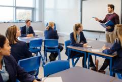 teacher instructs a classroom of teachers