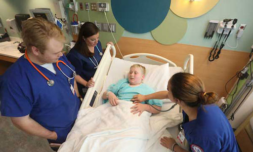 Medical students working in hospital setting.