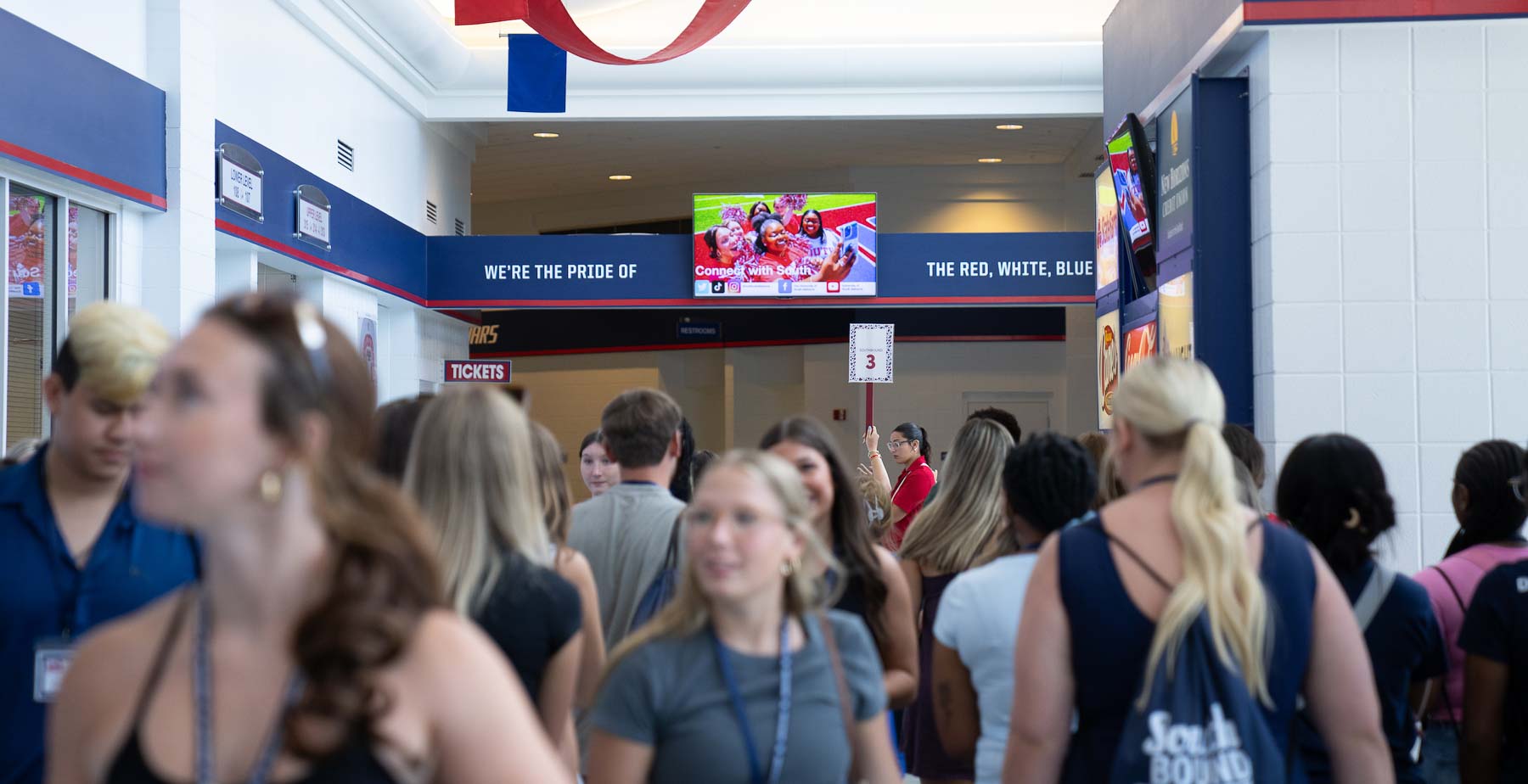 At the University of South Alabama Mitchell Center, doors open at 9 a.m. for Southbound orientation. On the concourse, students like up for check-in, take photos for their Jag Card and meet with college representatives. 