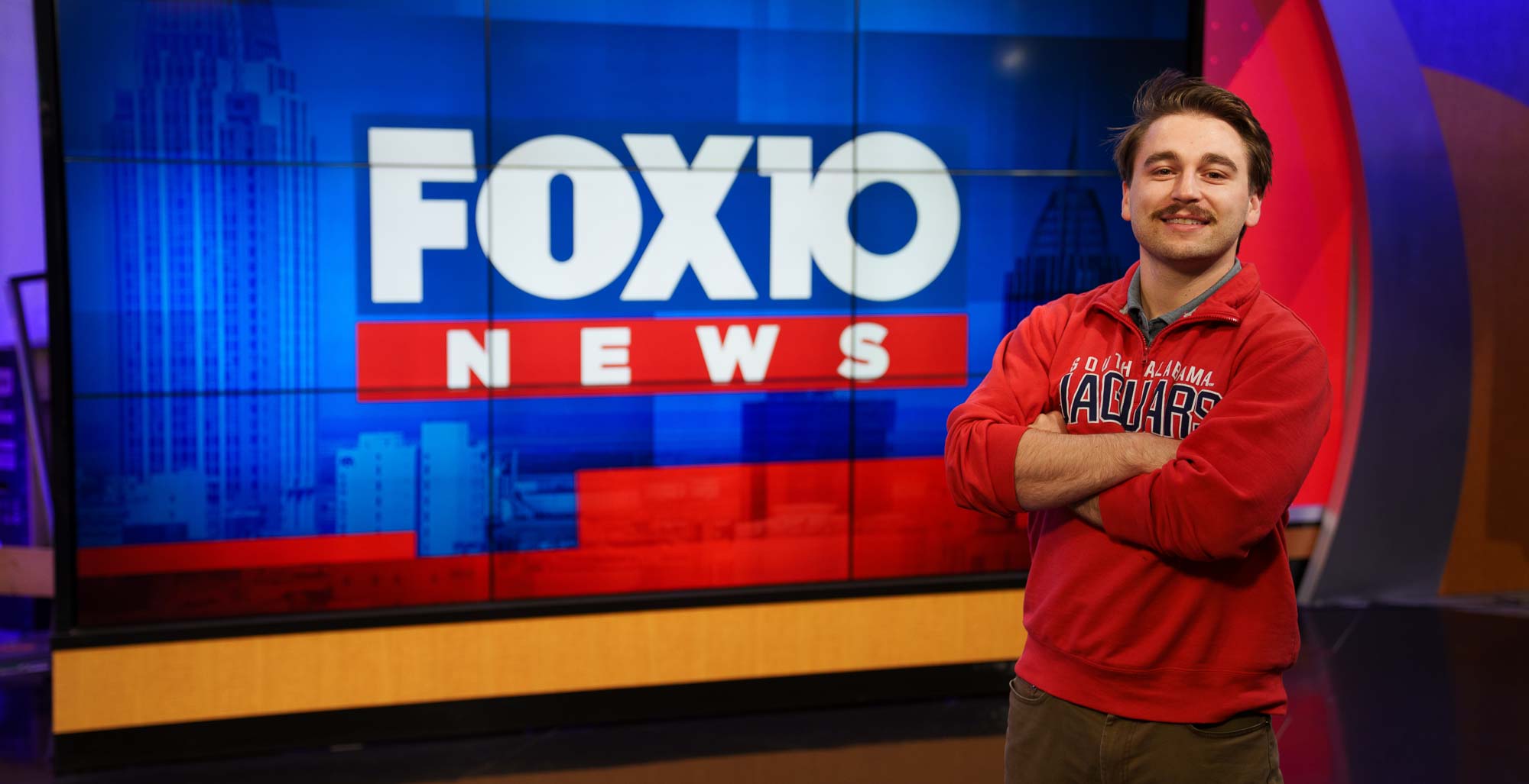 Logan Murphy at WALA FOX10, where he completed an internship before graduating in May with a degree in business and a concentration in sales. Five days after Commencement, the company hired him full time as a digital strategist account coordinator.